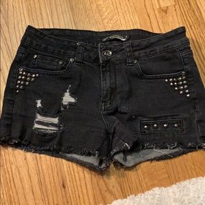 Black distressed jean shorts with studs